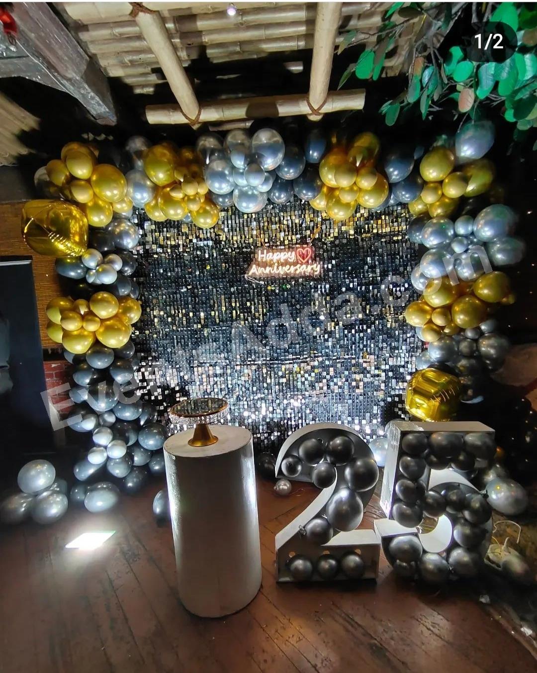 black--gold-shimmer-25th-anniversary-backdrop-decoration in Vijayawada