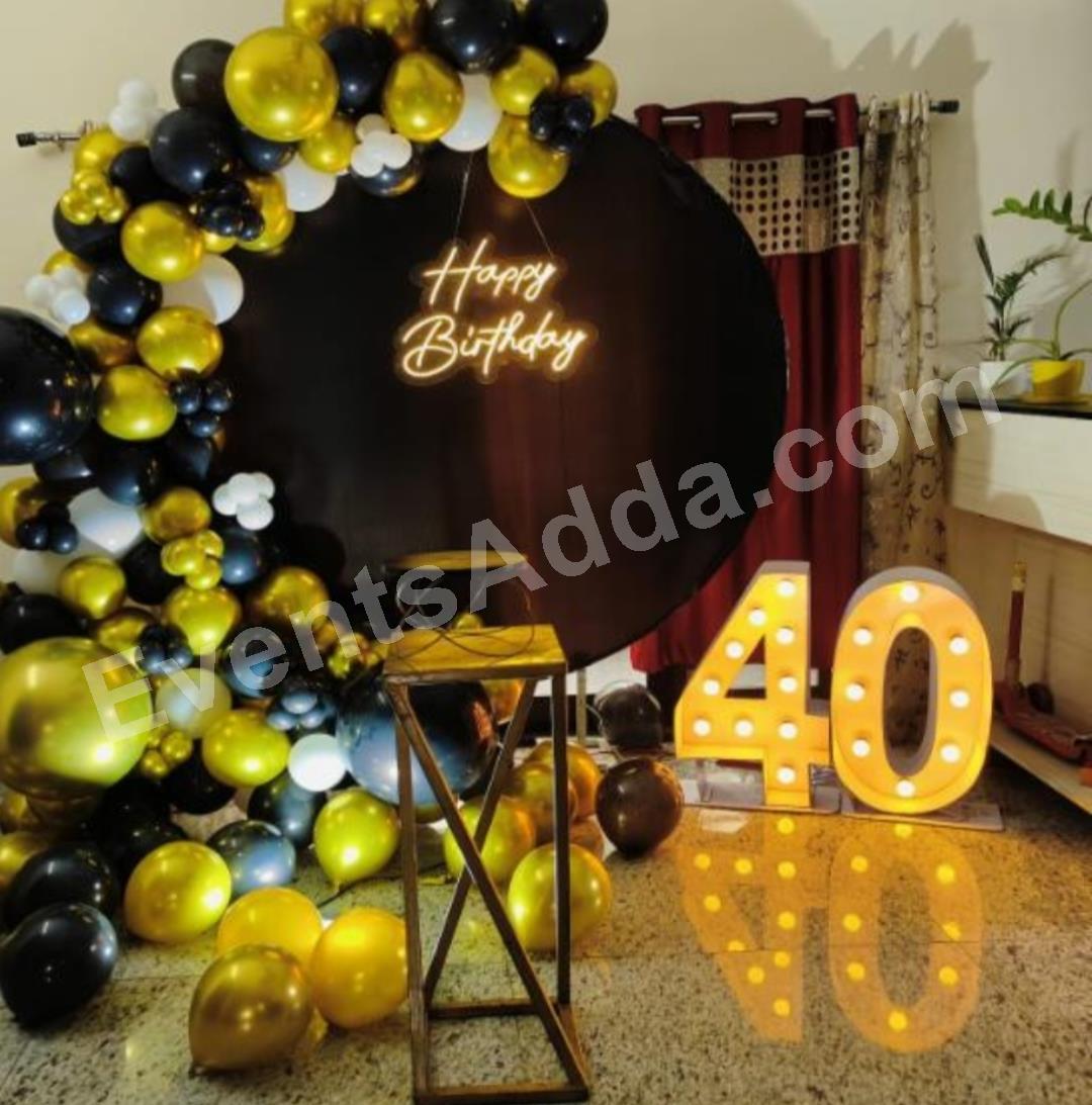 black-and-gold-40th-birthday-backdrop-decoration-4.jpg
