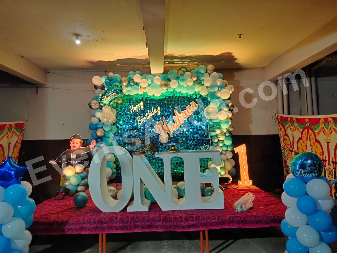 blue-shimmer-first-birthday-stage-decoration-with-one-letters in Vijayawada