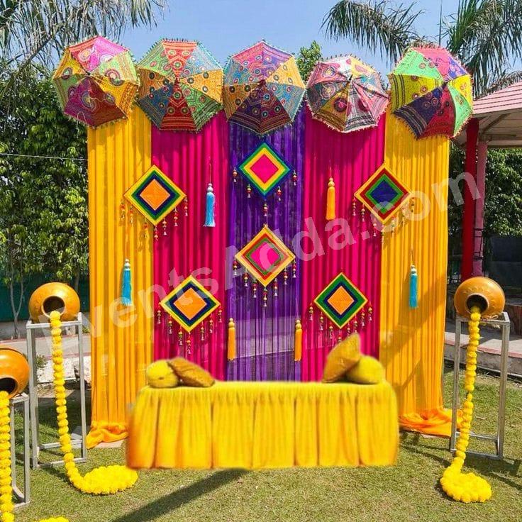 colorful-rajasthani-umbrella-haldi-ceremony-backdrop-decoration in Peddapalli
