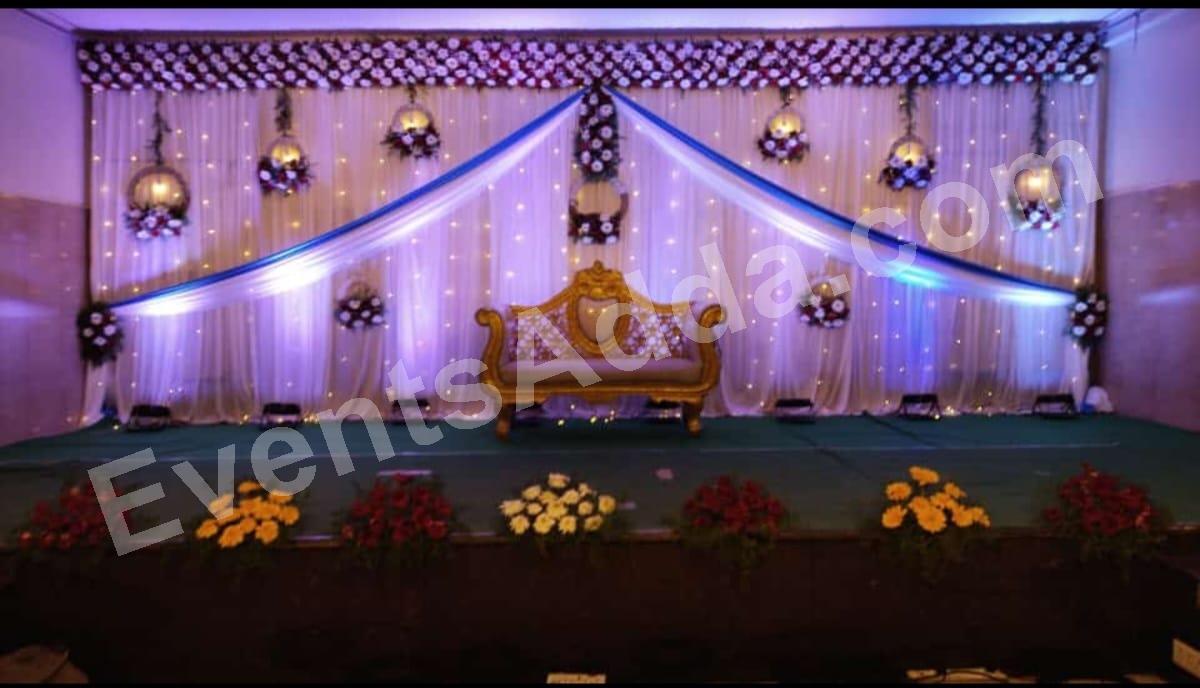 elegant-blue-draped-floral-reception-stage-decoration in Warangal Rural