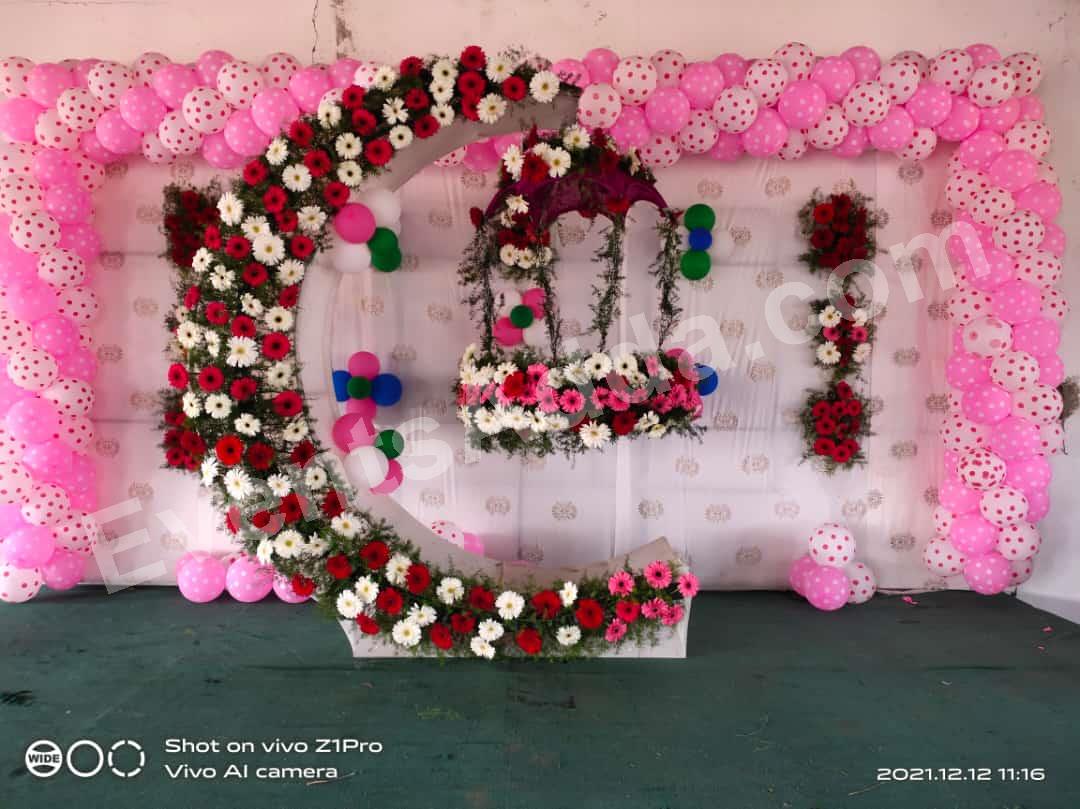 elegant-floral-moon-cradle-ceremony-decoration-with-balloon-backdrop in Jorhat