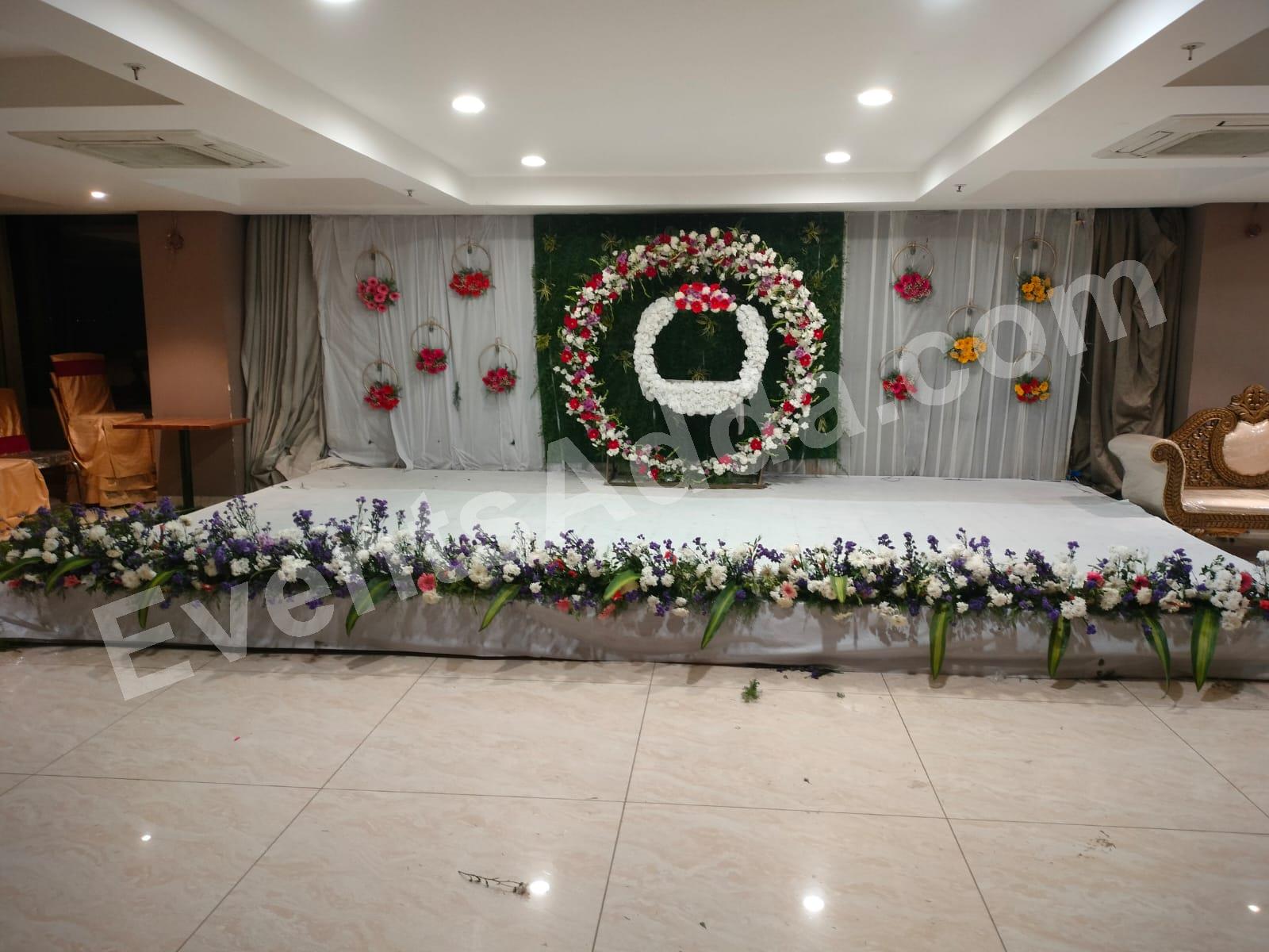 elegant-floral-ring-cradle-ceremony-stage-decoration in Jorhat