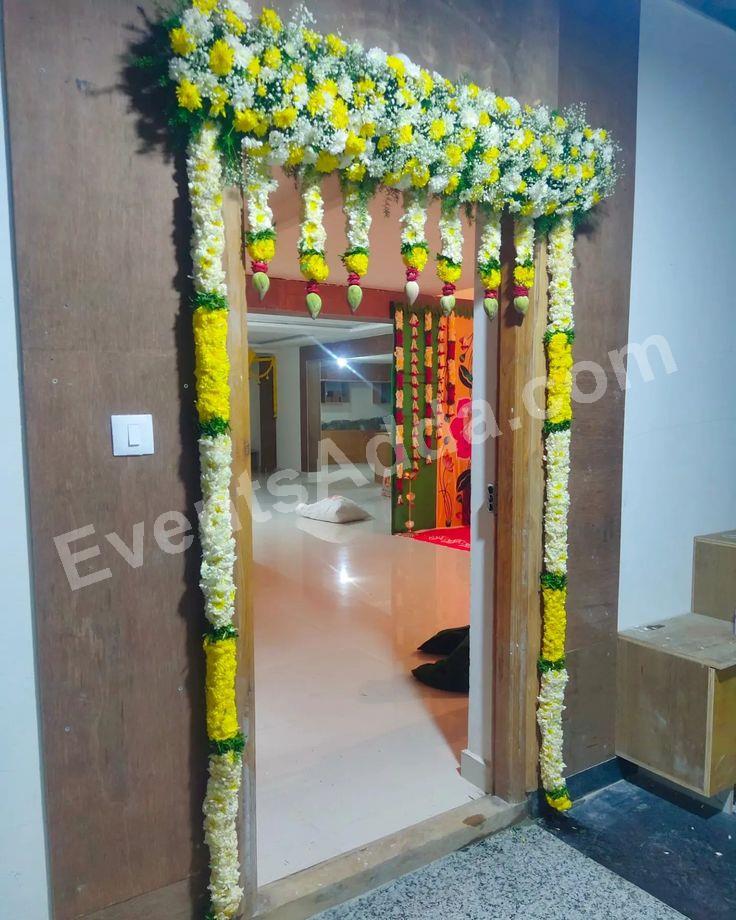 elegant-fresh-floral-door-entrance-decoration-with-lotus-bud-hangings in Jaipur
