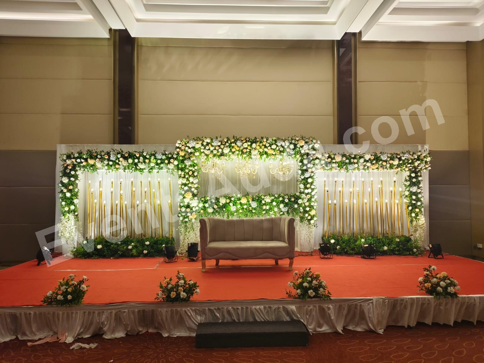 Elegant Green and White Floral Reception Stage Decoration Decoration in Vizag