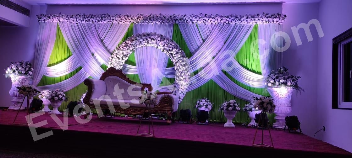 elegant-green-and-white-floral-ring-reception-stage-decoration in Warangal Rural