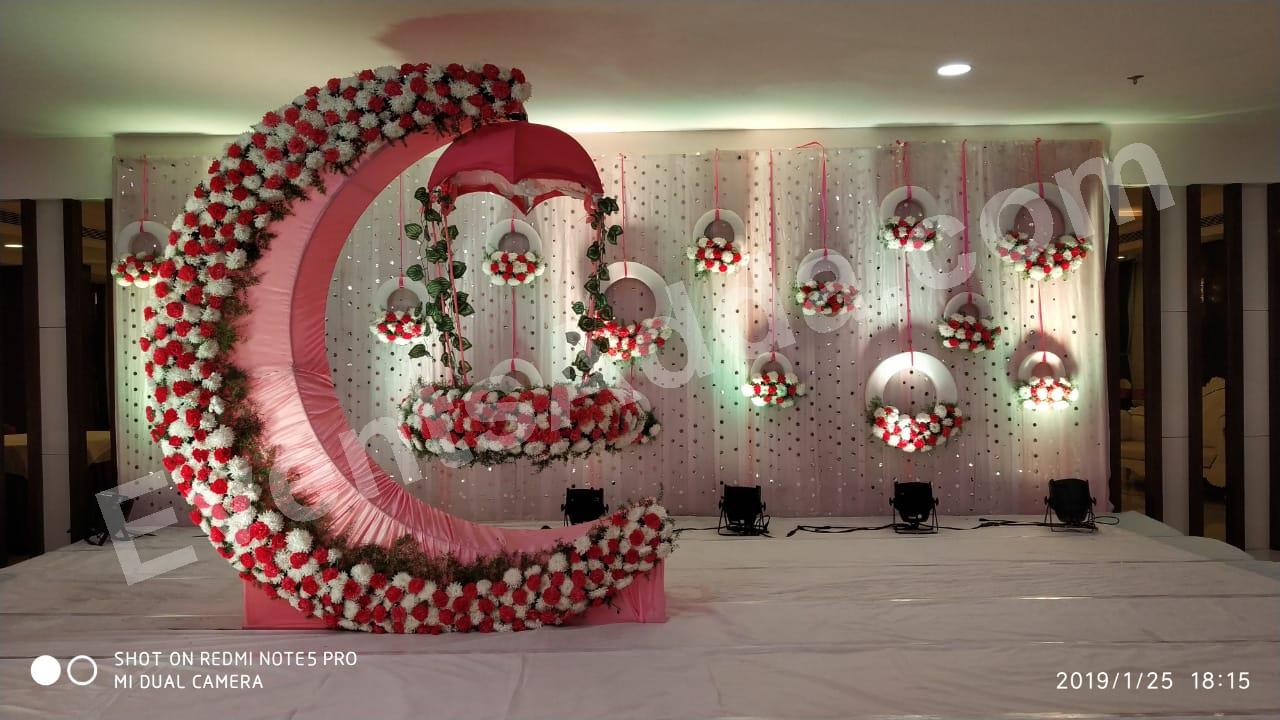 elegant-pink-floral-moon-cradle-ceremony-stage-decoration in Jorhat