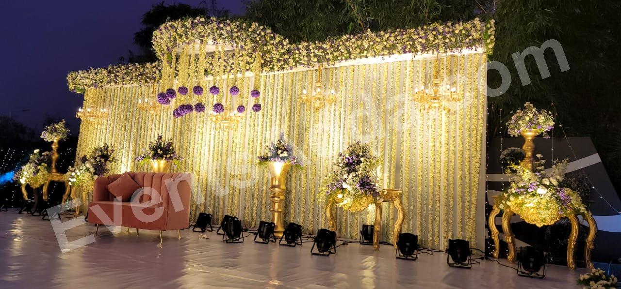 elegant-purple-and-gold-floral-reception-stage-decoration in Udaipur