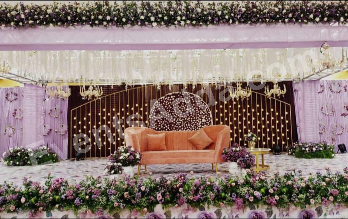 elegant-purple-and-peach-floral-stage-decoration in Warangal Rural