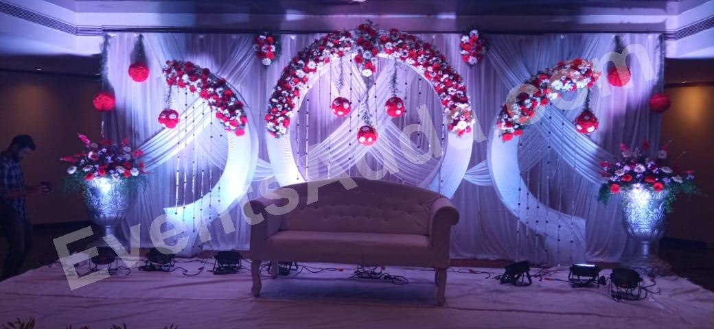 elegant-red--white-floral-ring-sofa-stage-decoration in Bangalore