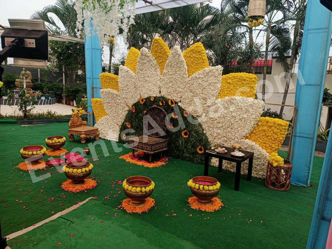 elegant-white--yellow-lotus-floral-haldi-stage-decoration in Bangalore