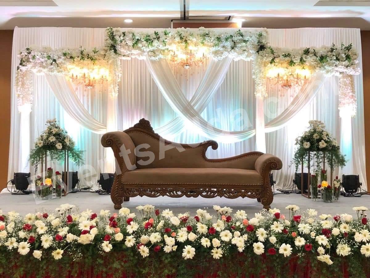 elegant-white-floral-draped-reception-stage-decoration in Warangal Rural