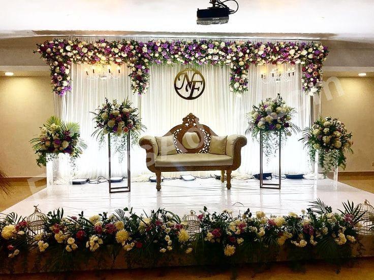 Elegant White Floral Reception Stage Decoration Decoration in Siddipet