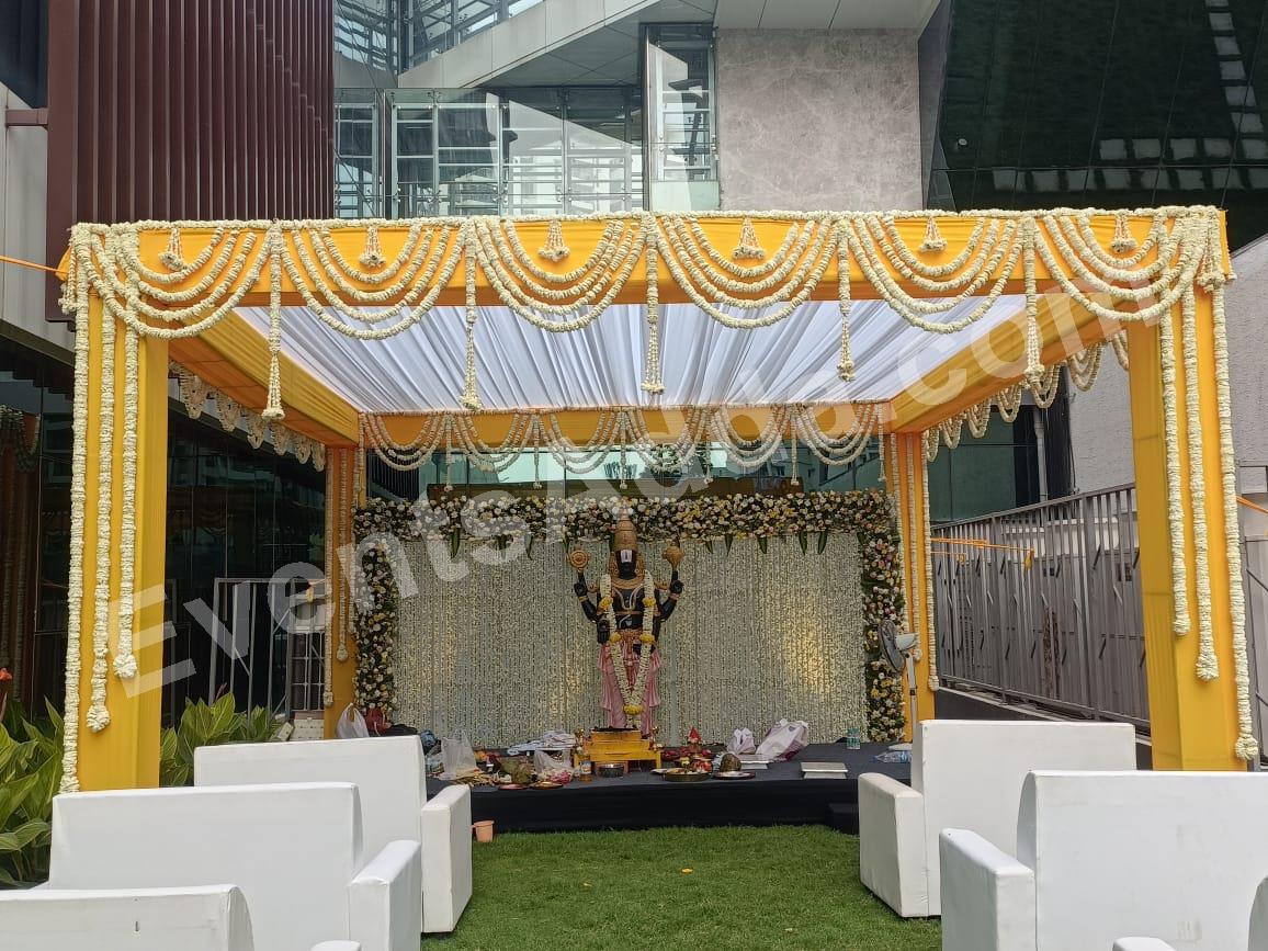 elegant-yellow-and-white-floral-pooja-stage-decoration in Vizag