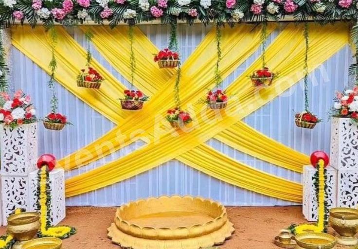 elegant-yellow-draped-floral-haldi-ceremony-decoration-2.jpg