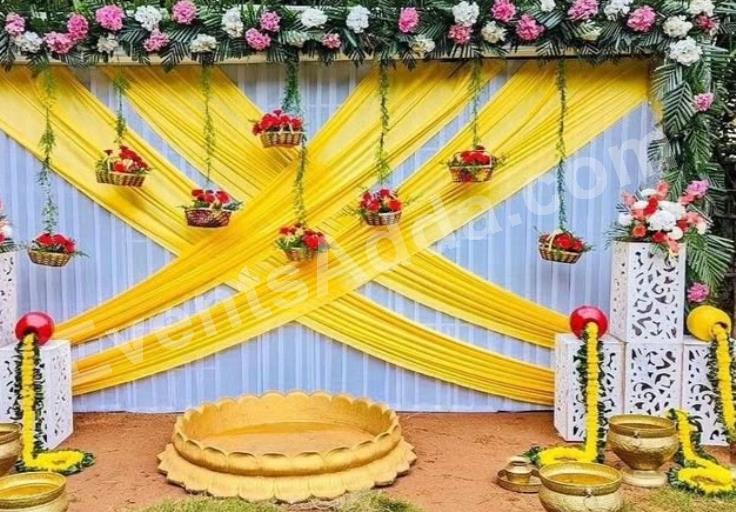 elegant-yellow-draped-floral-haldi-ceremony-decoration-4.jpg