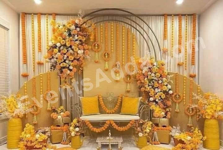 elegant-yellow-floral-haldi-ceremony-stage-decoration in Bangalore