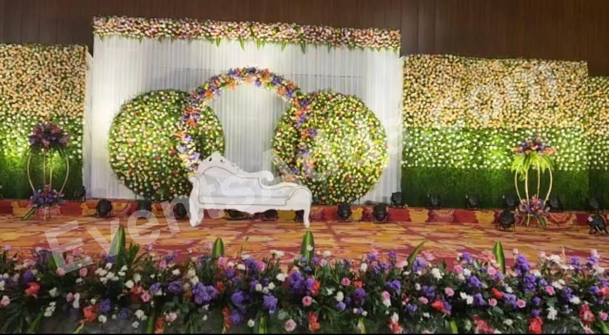 floral-garden-reception-stage-with-white-vintage-sofa in Warangal Rural