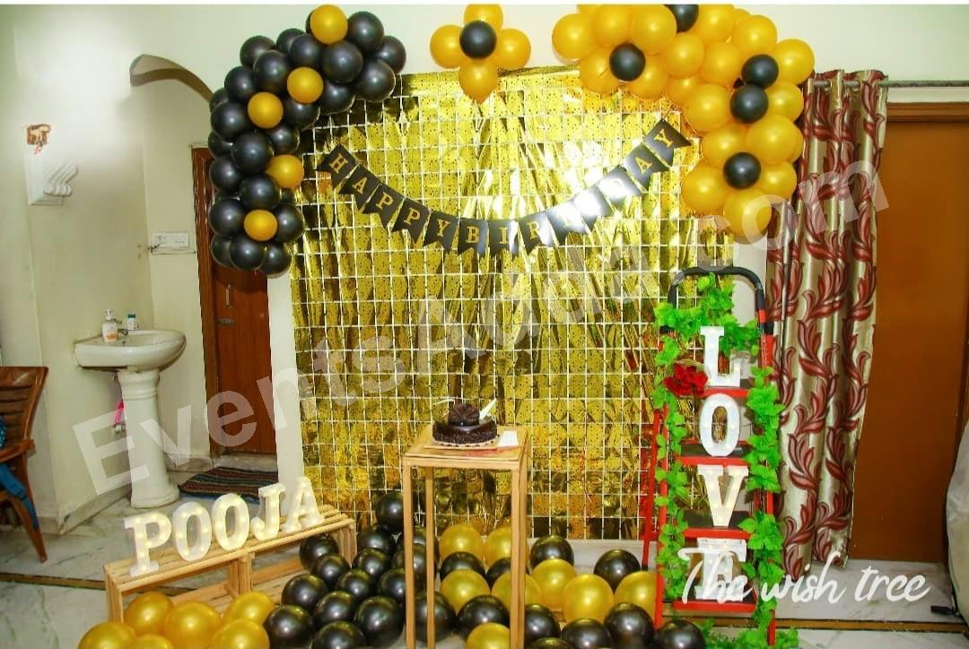 gold-fringe-backdrop-with-black--gold-balloon-decoration in Vijayawada