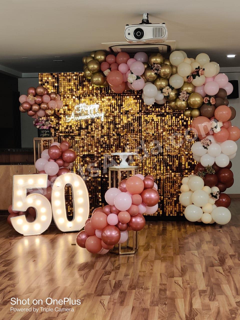 golden-50th-anniversary-shimmer-backdrop-decoration in Vijayawada