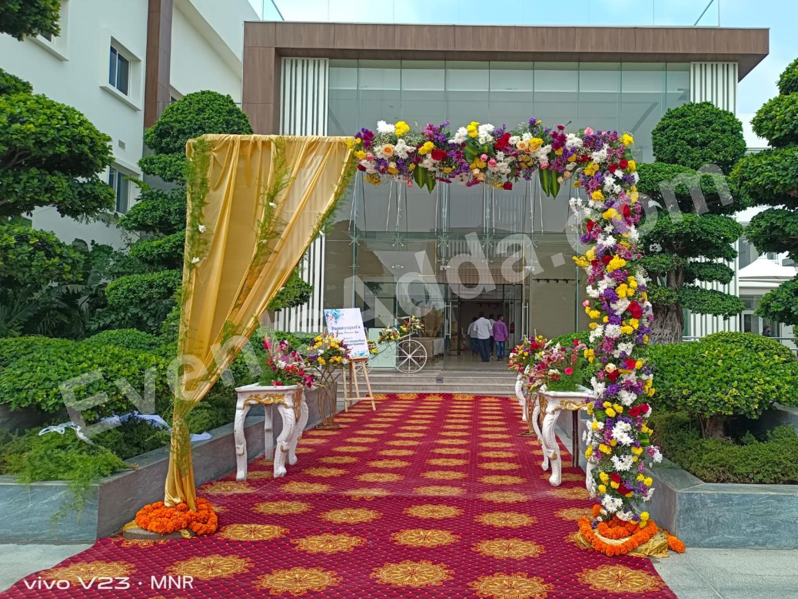 luxury-floral-entrance-arch-with-gold-drapes-3.jpg