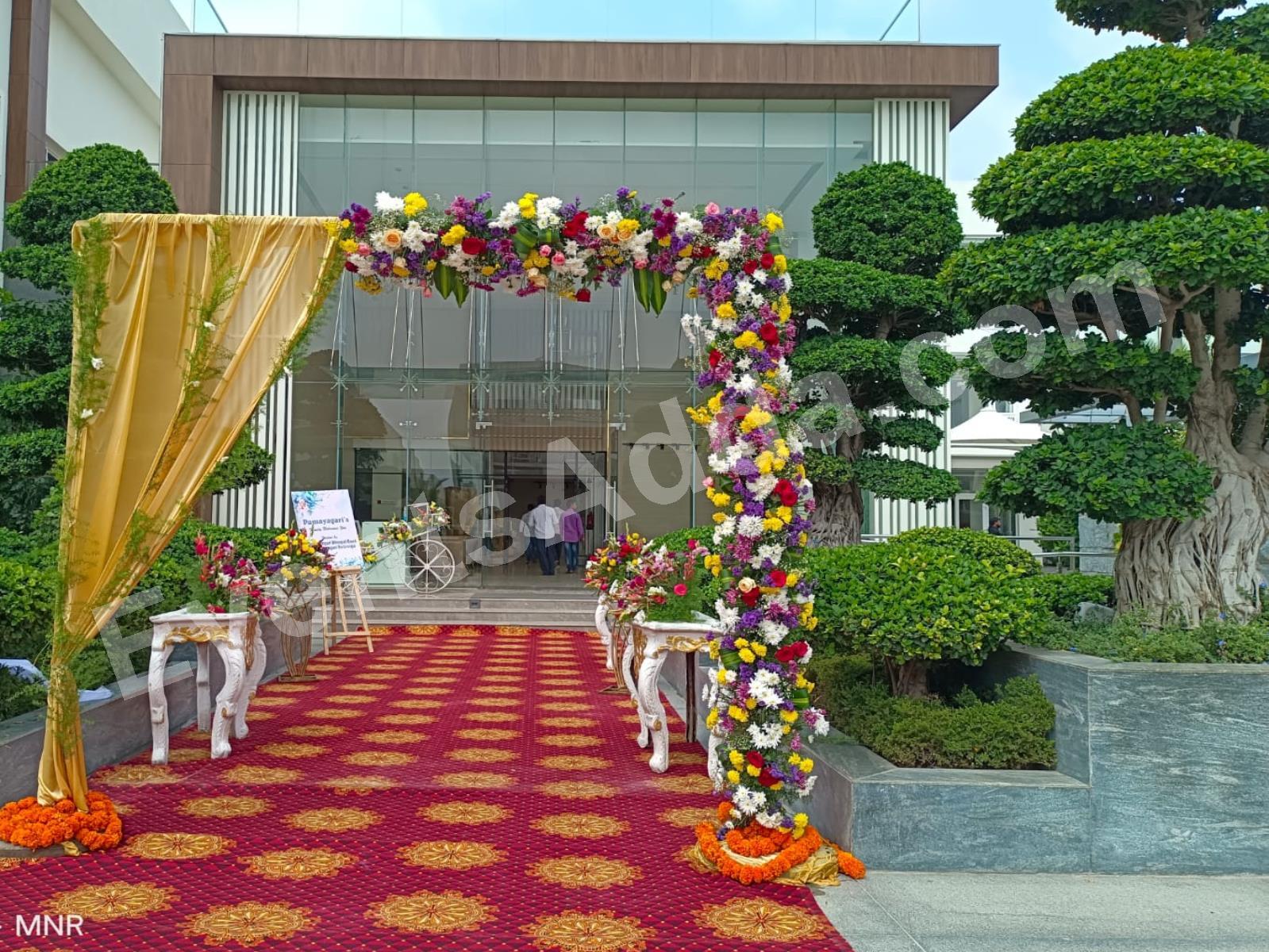 luxury-floral-entrance-arch-with-gold-drapes-4.jpg