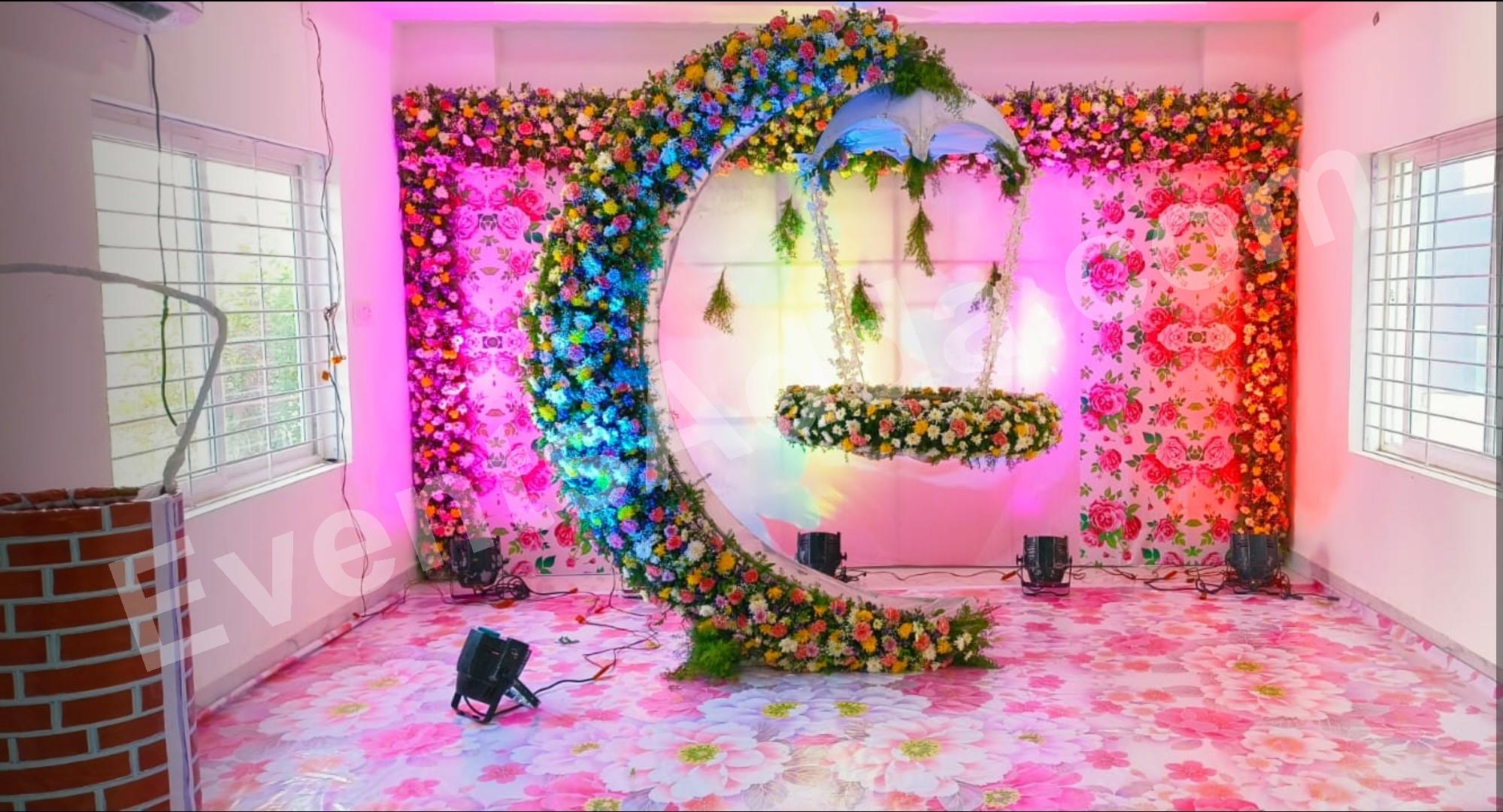 luxury-floral-moon-cradle-ceremony-stage-decoration-with-umbrella-canopy in Jorhat
