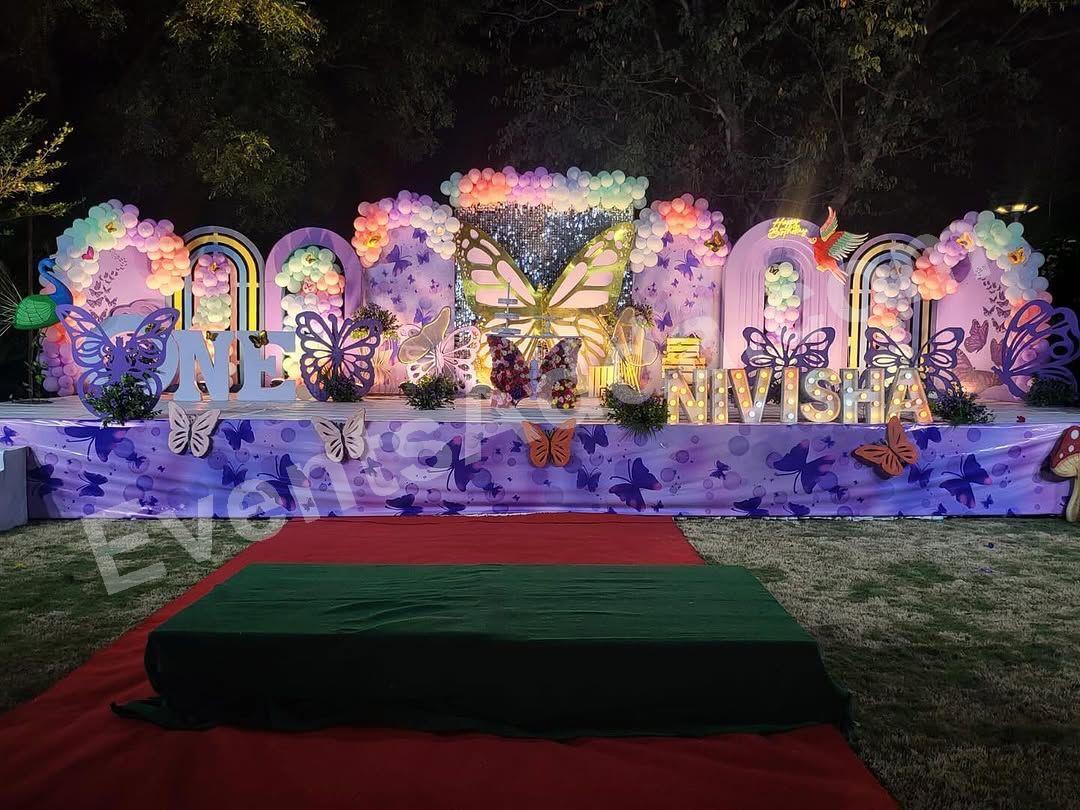 luxury-lavender-butterfly-garden-theme-first-birthday-stage-decoration Decoration in =Hyderabad