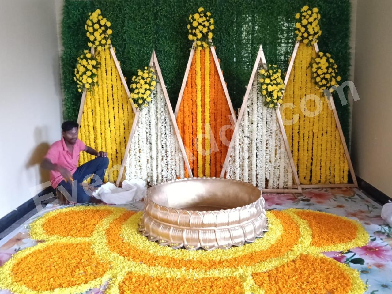 modern-triangle-floral-haldi-ceremony-decoration-2.jpg