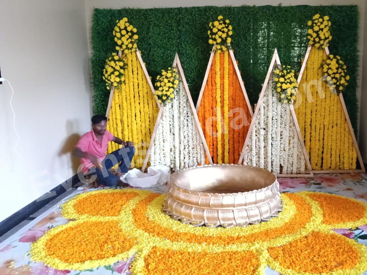 modern-triangle-floral-haldi-ceremony-decoration-3.jpg