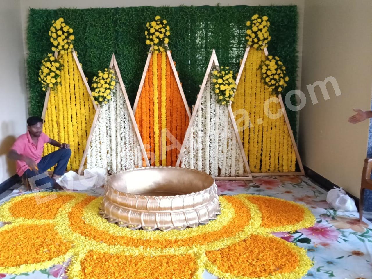 modern-triangle-floral-haldi-ceremony-decoration-4.jpg