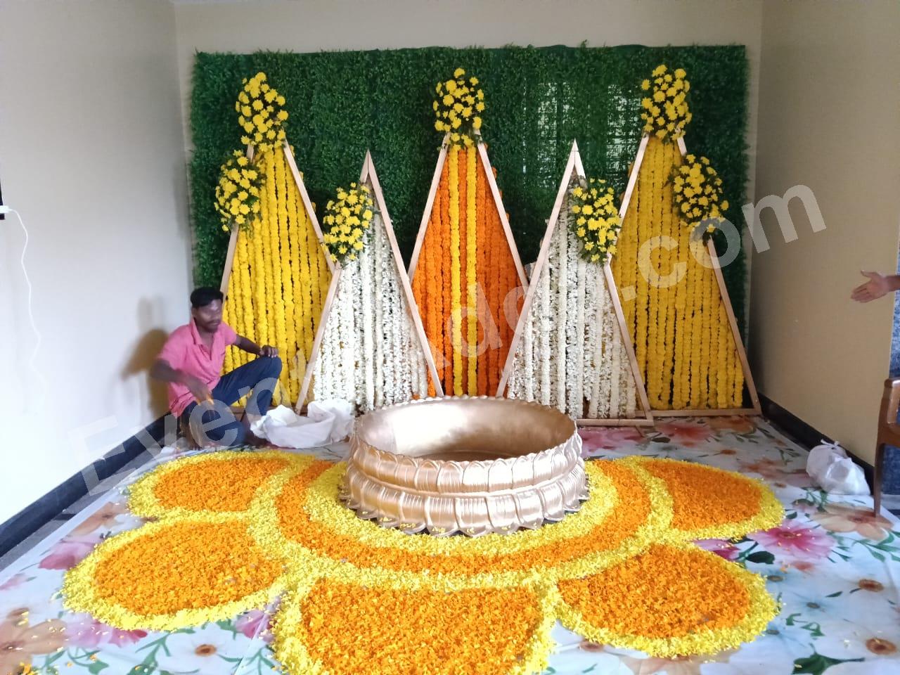 modern-triangle-floral-haldi-ceremony-decoration Decoration in =Hyderabad