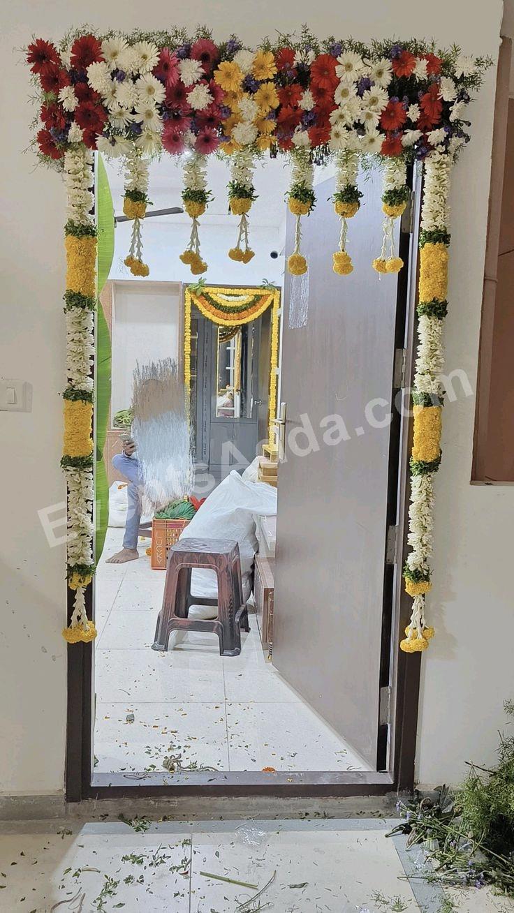 premium-fresh-floral-door-entrance-decoration-with-hanging-marigold-tassels in Jaipur