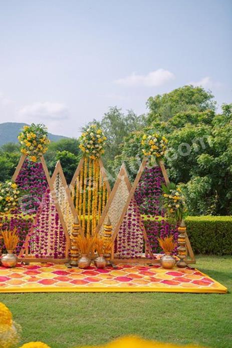 royal-triangle-floral-haldi-backdrop-decoration-4.jpg