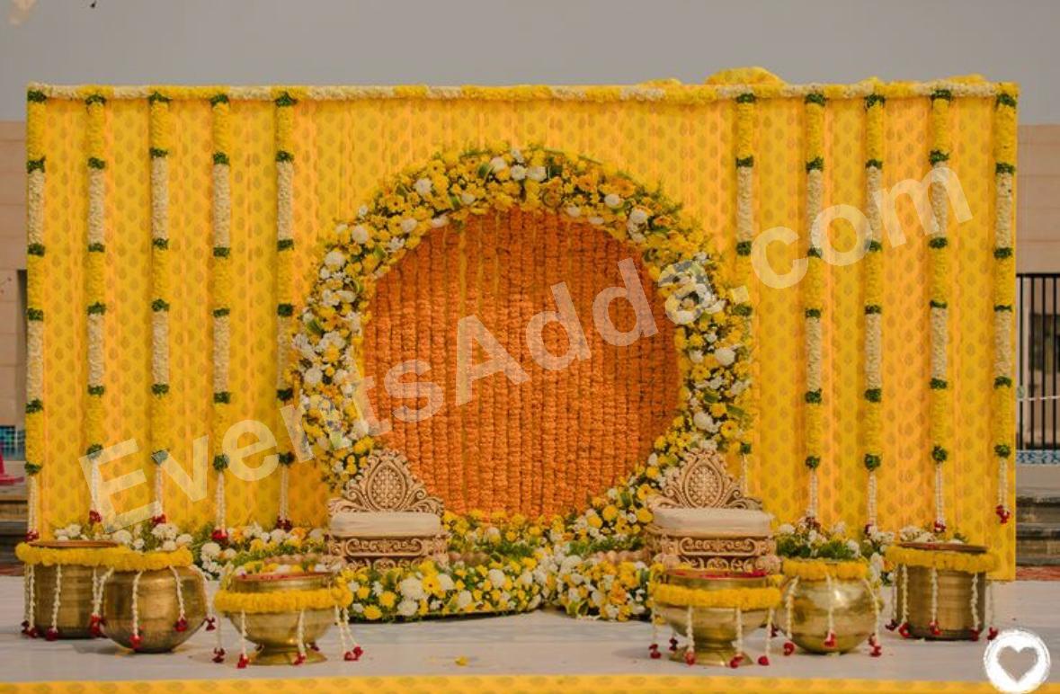 royal-yellow-floral-haldi-ceremony-stage-decoration in Peddapalli