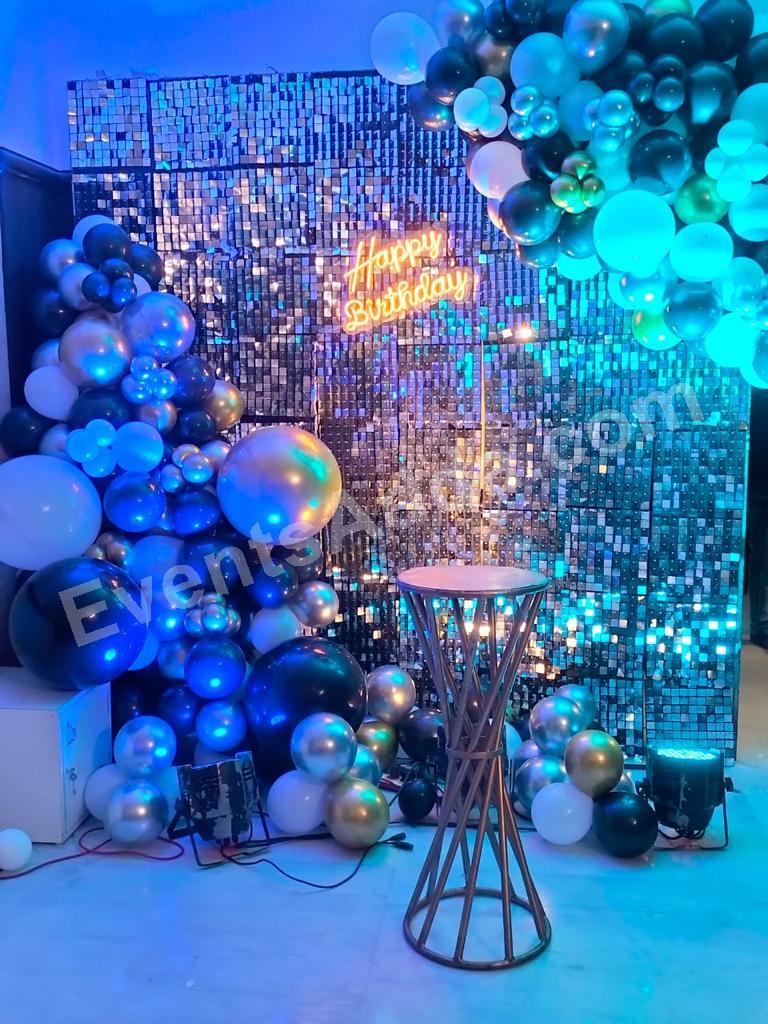 silver-shimmer-birthday-backdrop-with-blue-balloon-garland in Vijayawada
