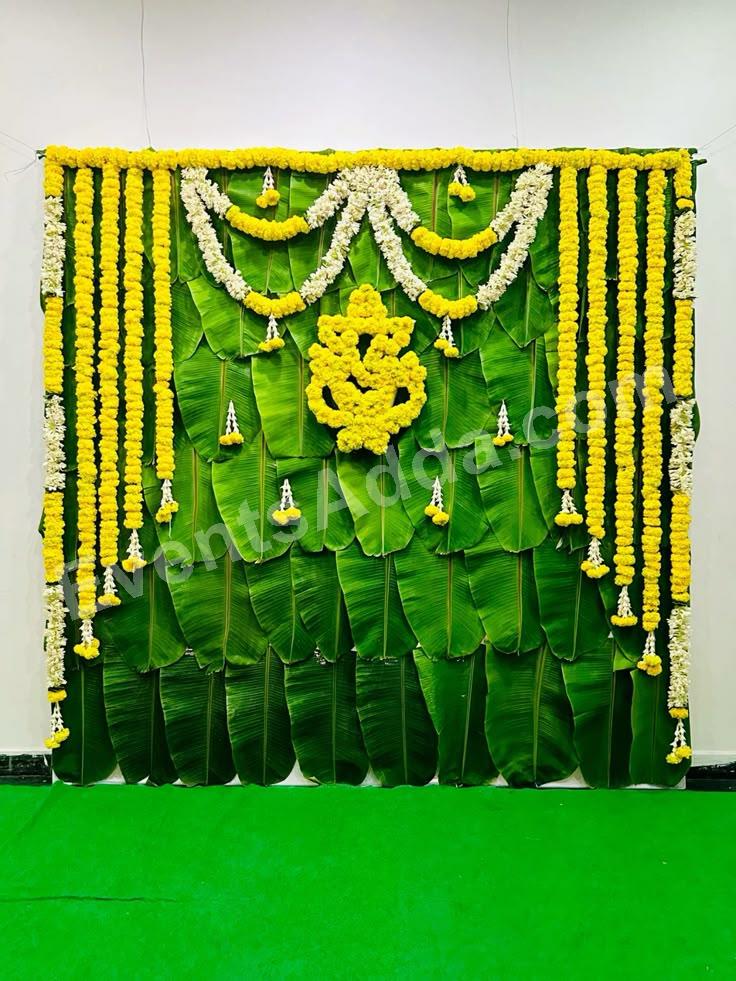 traditional-banana-leaf-haldi-backdrop-decoration-with-floral-ganesha in Jaipur