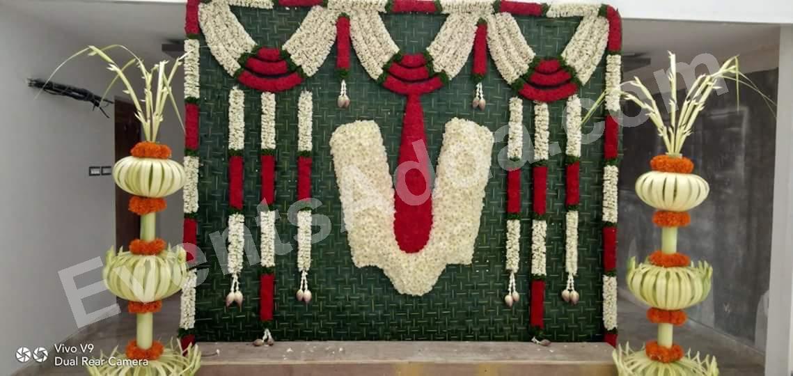 Traditional White and Red Floral Haldi Backdrop Decoration in Udaipur