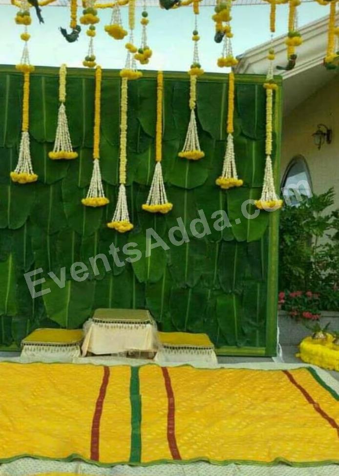 traditional-yellow-and-green-haldi-ceremony-decoration-4.jpg