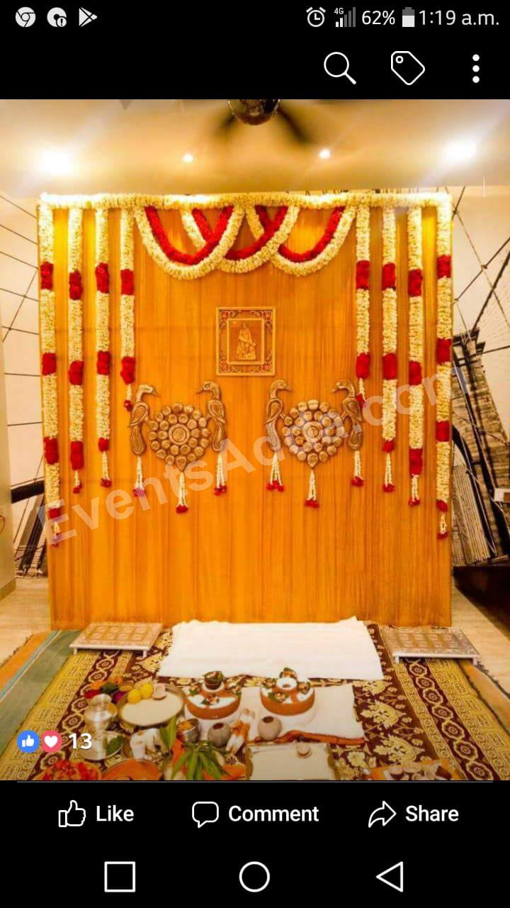 Traditional Yellow and Red Floral Pooja Backdrop Decoration in Udaipur