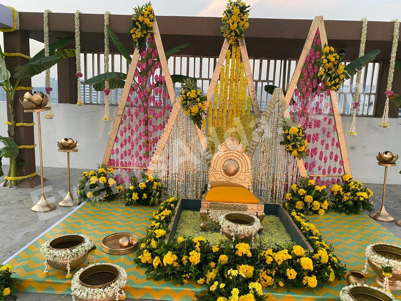 Traditional Yellow Floral Haldi Ceremony Decoration with Royal Seating in Udaipur