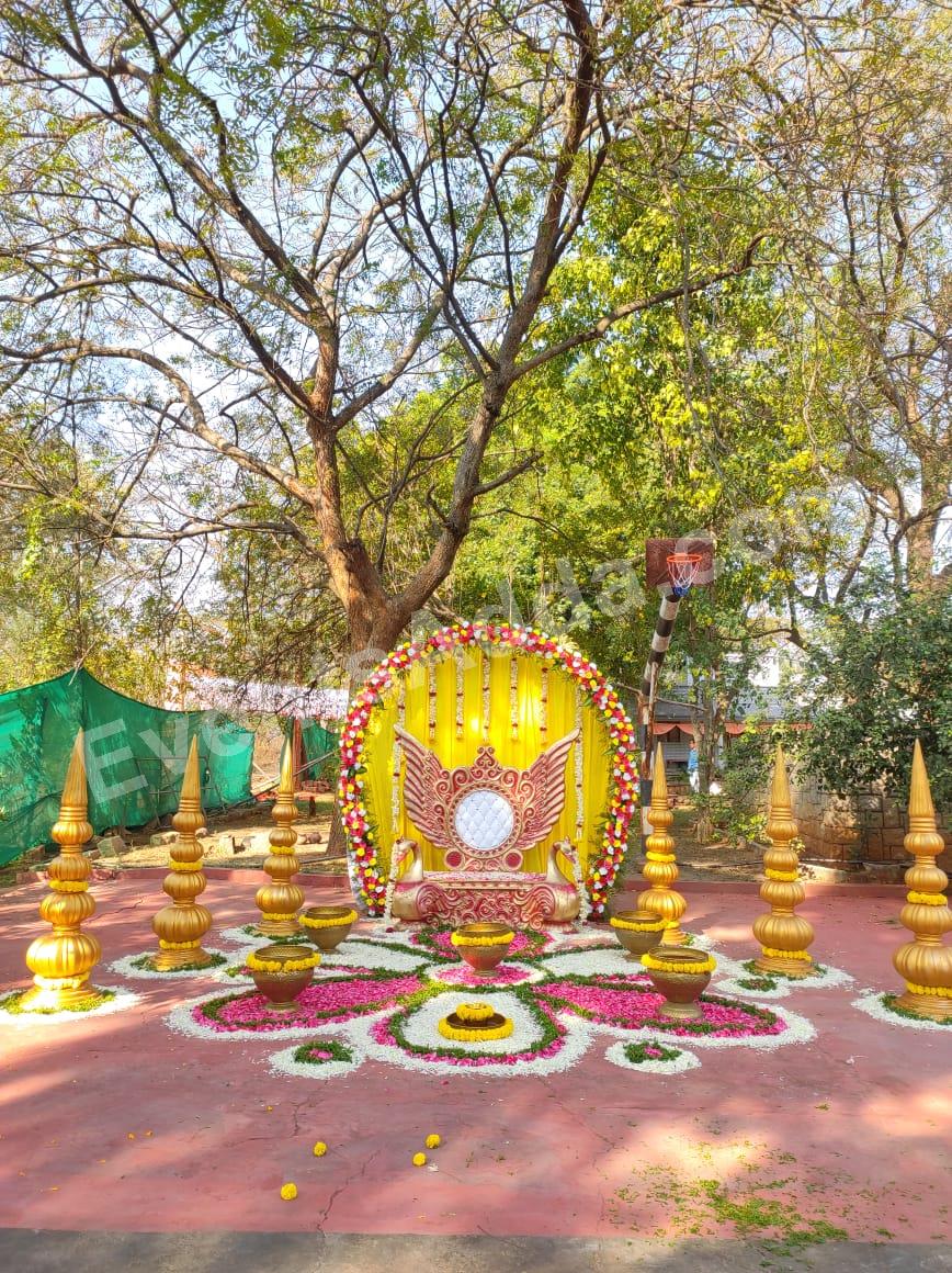 traditional-yellow-floral-haldi-swing-stage-decoration in Bangalore