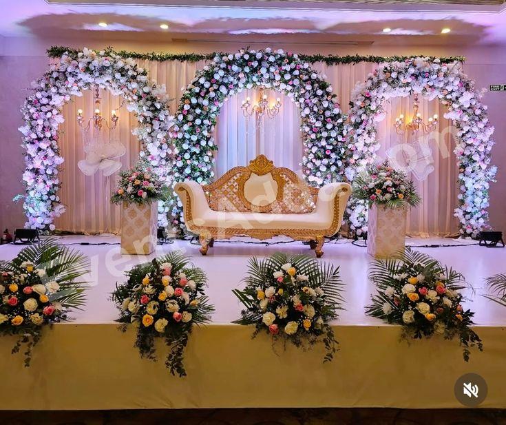 triple-floral-ring-wedding-stage-decoration in Peddapalli