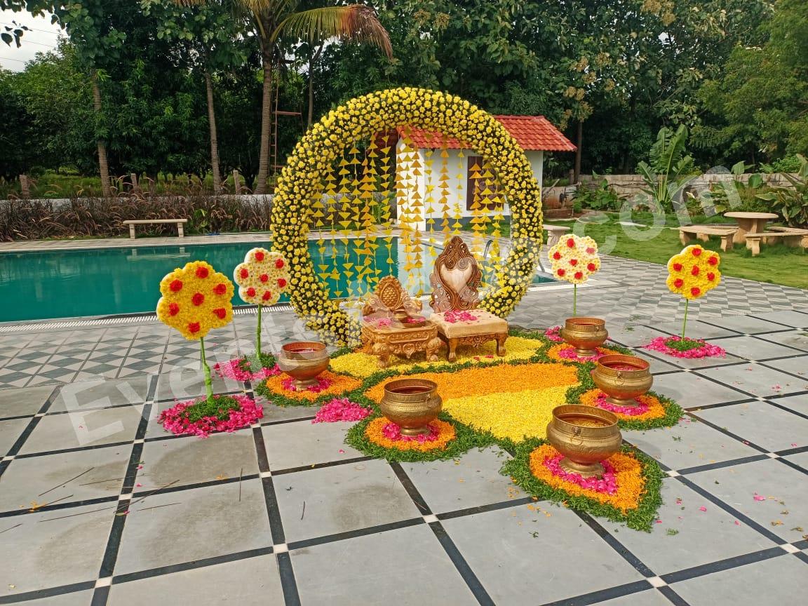 yellow-floral-circular-haldi-stage-decoration in Bangalore